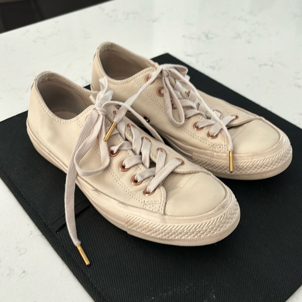 Women’s gold All-Star Converse, tennis shoes